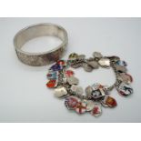 A German silver charm bracelet, stamped 835, with a good amount of town crest charms,