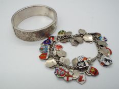 A German silver charm bracelet, stamped 835, with a good amount of town crest charms,
