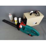 A Bosch AHS 41ACCU hedge trimmer and a Conopois air compressor.