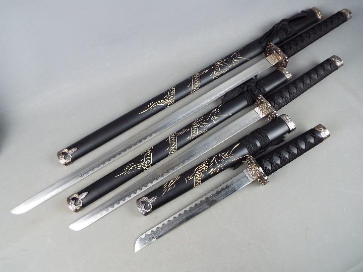 A set of three reproduction Japanese swords, longest approximately 101 cm, - Image 2 of 5