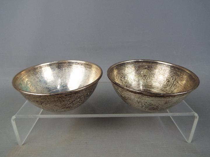 Two Egyptian silver bowls with chased decoration, c.1943, approximately 210 grams all in.