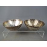 Two Egyptian silver bowls with chased decoration, c.1943, approximately 210 grams all in.