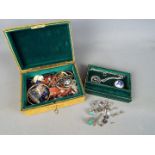 A jewellery box containing a quantity of costume jewellery including continental silver pieces and