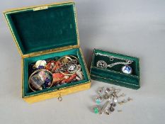 A jewellery box containing a quantity of costume jewellery including continental silver pieces and