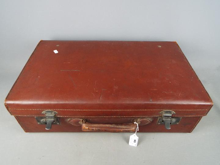 A vintage suitcase, a 19th century blue and white water jug, - Image 2 of 4