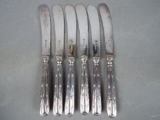 A set of six George V hallmarked silver butter knives,