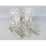 A pair of early 20th century clear glass lustres with a quantity of additional drops.