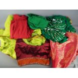 Saree / Sari - A two piece sari set in green, a three piece set in red and similar.