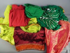 Saree / Sari - A two piece sari set in green, a three piece set in red and similar.