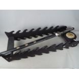 A reproduction Japanese sword with dragon decorated tsuba,