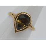 9ct Gold - a 9ct gold ring set with smoky quartz, size L, approximately 2.4 grams all in.