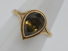 9ct Gold - a 9ct gold ring set with smoky quartz, size L, approximately 2.4 grams all in.