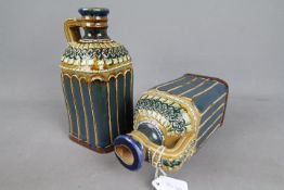 A pair of Doulton Lambeth stoneware, square section, decanters,