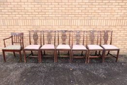 A set of six George III style mahogany dining chairs each with serpentine eared top rail,