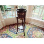 A 19th century coopered oak and brass bound barrel planter / plant stand torchere raised on shaped