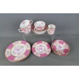 Minton - A collection of dinner and tea wares in the 'Pink Cockatrice' pattern # 9646, 15 pieces.