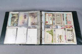 Deltiology - an album containing approximately 240 early period postcards to include topographical,