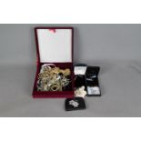 A velvet jewellery box containing a quantity of good quality evening jewellery to include brooches,