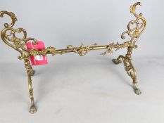 A Victorian brass Fire Dogs stand, 33 cm x 52.