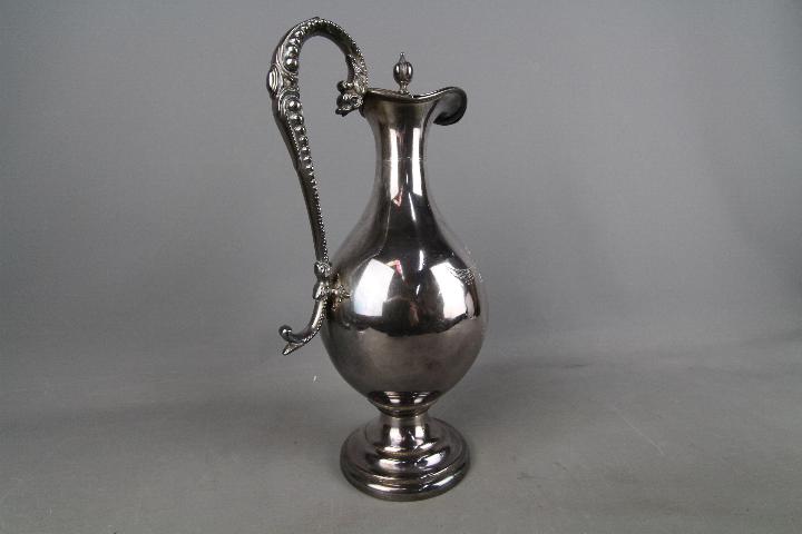 A large silver plated wine ewer with chased decoration of fruiting vine, - Image 2 of 3