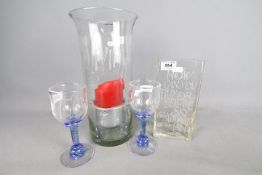 Two Andrew Sanders wine glasses,