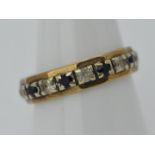 9ct Gold - a 9ct gold eternity ring stone set with sapphires , stamped 375, size R,