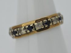 9ct Gold - a 9ct gold eternity ring stone set with sapphires , stamped 375, size R,