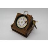 A lady's silver cased Swiss fob watch, pink and white enamel dial with gilt highlights,