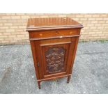 A side cupboard with inlaid and carved decoration,