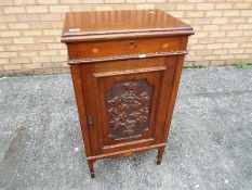 A side cupboard with inlaid and carved decoration,