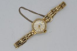 A lady's 9ct gold cased, Griffon, 21 jewel wristwatch on 9ct gold bracelet,