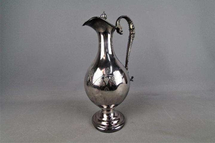 A large silver plated wine ewer with chased decoration of fruiting vine, - Image 3 of 3