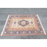 A good quality silk carpet measuring approximately 300 cm x 200 cm.