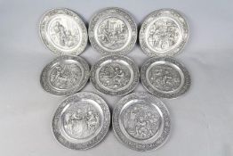Eight German pewter wall plates by SKS from the 'Traditionelles Handwerk' collection,