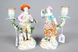 A pair of late 18th century porcelain figural candle holders, possibly Derby,