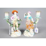 A pair of late 18th century porcelain figural candle holders, possibly Derby,