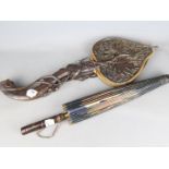 A set of Bellows intricately carved with foliate and fruit decoration and an Oriental parasol with