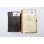 An ivory backed Book of Common Prayer with gilt metal clasp border and ribbed leather spine,