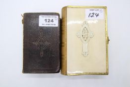 An ivory backed Book of Common Prayer with gilt metal clasp border and ribbed leather spine,