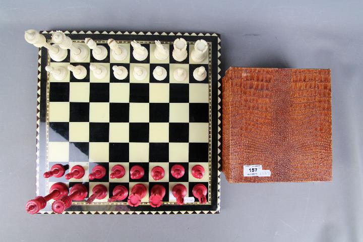 An early 20th century bone chess set with stained and natural pieces, king approximately 9 cm (h),