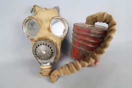 A World War Two (WWII) gas mask 4A by Barringer, Wallis & Manners Limited, 1940.