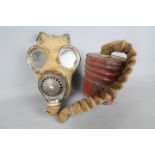 A World War Two (WWII) gas mask 4A by Barringer, Wallis & Manners Limited, 1940.