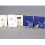 Swarovski Crystal - four Swarovski Crystal collectables to include a graduation cap,