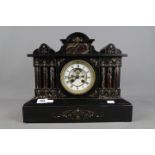 A good French black marble architectural mantel clock, with contrasting marble columns,