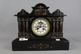 A good French black marble architectural mantel clock, with contrasting marble columns,