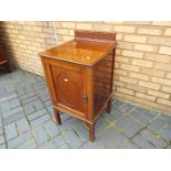 A mahogany bedside cabinet,