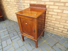 A mahogany bedside cabinet,