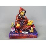 Royal Doulton - a figurine entitled 'The Potter' HN 1493, signed to the base by Michael Doulton,