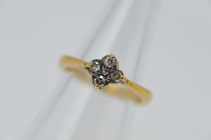 A 22ct gold ring set with a cluster of diamonds, size L, approximately 4 grams all in. - Image 3 of 4