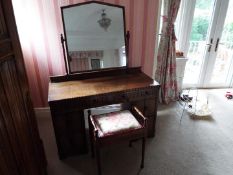 An oak knee-hole dressing table with swing mirror and stool,